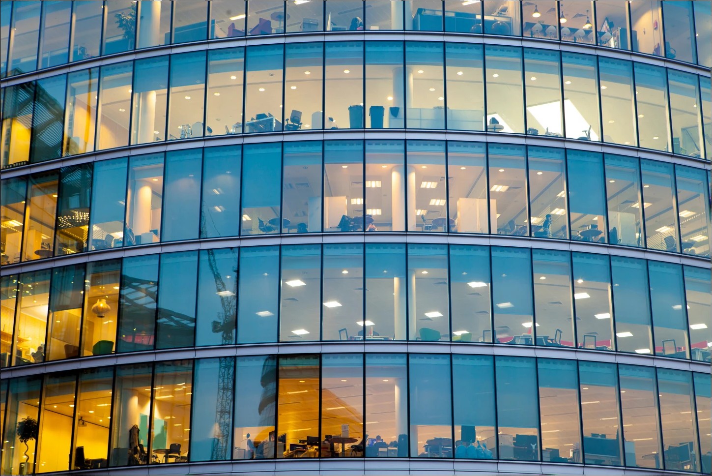A modern office building at dusk